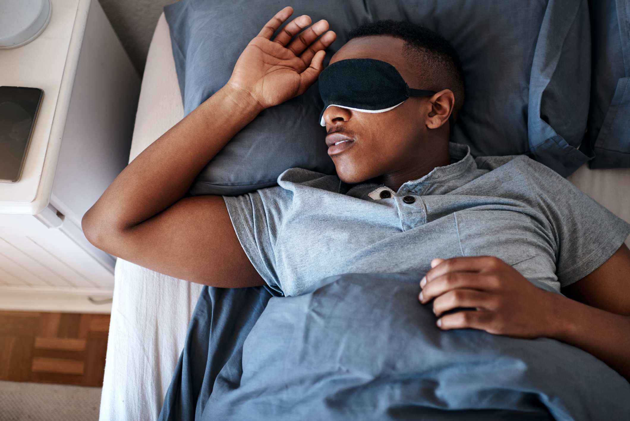 Black male sleeping with eye mask