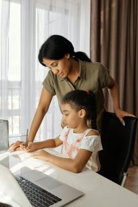 Mother and daugher at computer